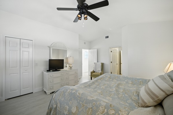 Third view of spacious guest bedroom with king-size bed at Pinnacle, Unit 2503 Naples vacation rental