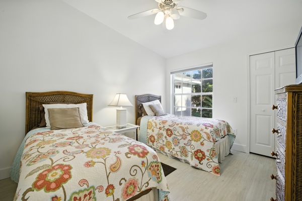 Bedroom with two comfortable twin-size beds and ample closet space at Pinnacle, Unit 2503 Naples FL