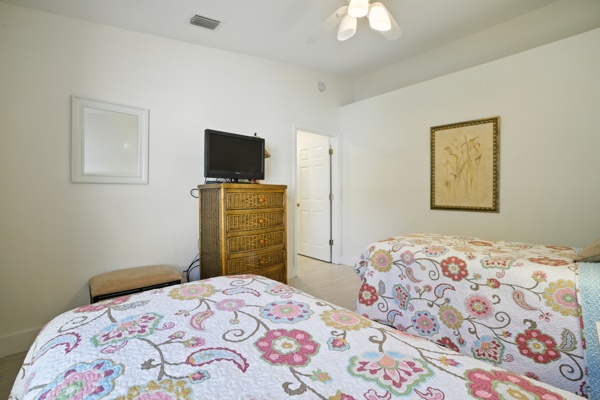 Third view of bedroom with two comfortable twin-size beds at Pinnacle, Unit 2503 Naples FL
