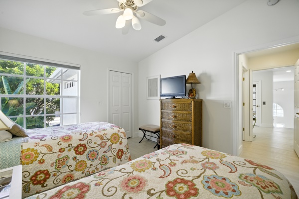 Second view of bedroom with two twin-size beds suitable for children or adults at Pinnacle, Unit 2503 Naples FL
