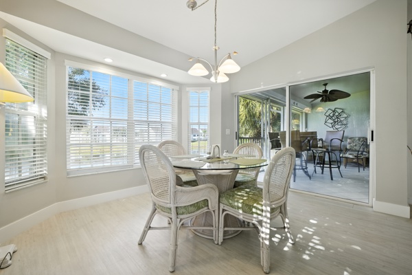 Kitchen seating area with view of enclosed lanai at Pinnacle, Unit 2503 Naples FL vacation home