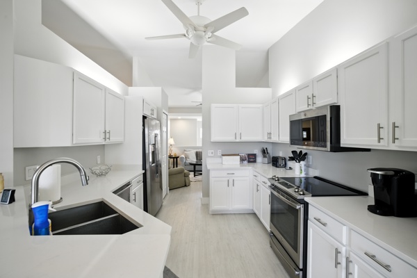 Renovated kitchen with updated appliances at Pinnacle, Unit 2503 Naples FL vacation home