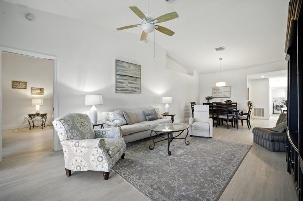 Living room with view into master bedroom entrance at Pinnacle, Unit 2503 Naples FL vacation home