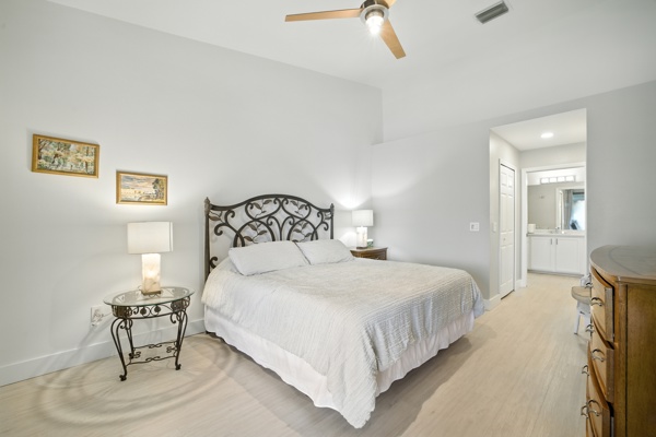 Master bedroom suite with full private bathroom and walk-in shower at Pinnacle, Unit 2503 Naples FL