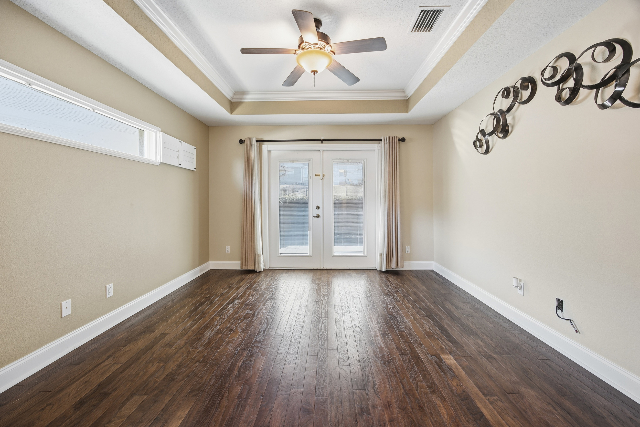 6440 SW 50th Terr address detail with arched entry, manicured landscaping