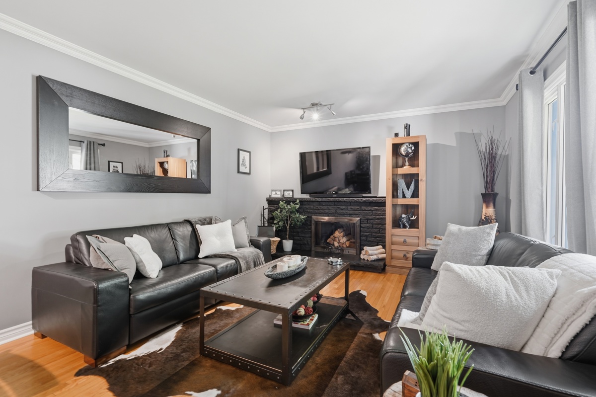 Living room with fireplace — ranch bungalow East London Ontario