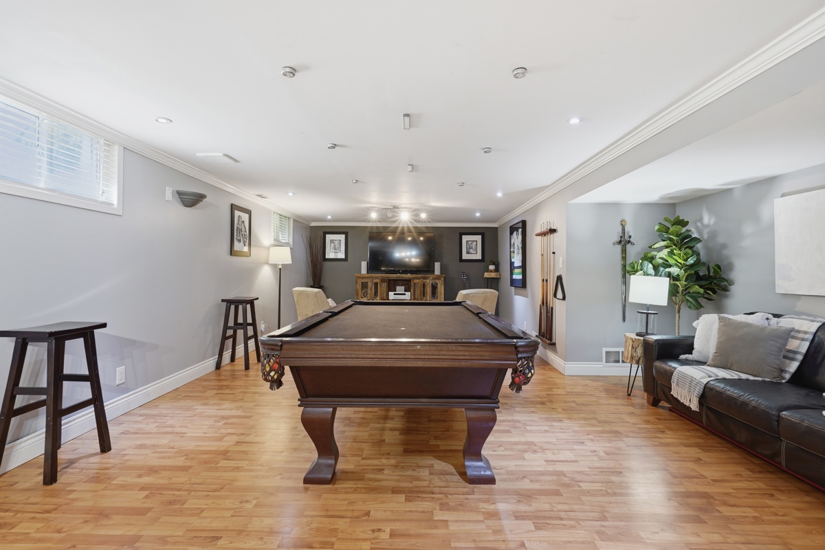 Lower level rec room — East London bungalow basement