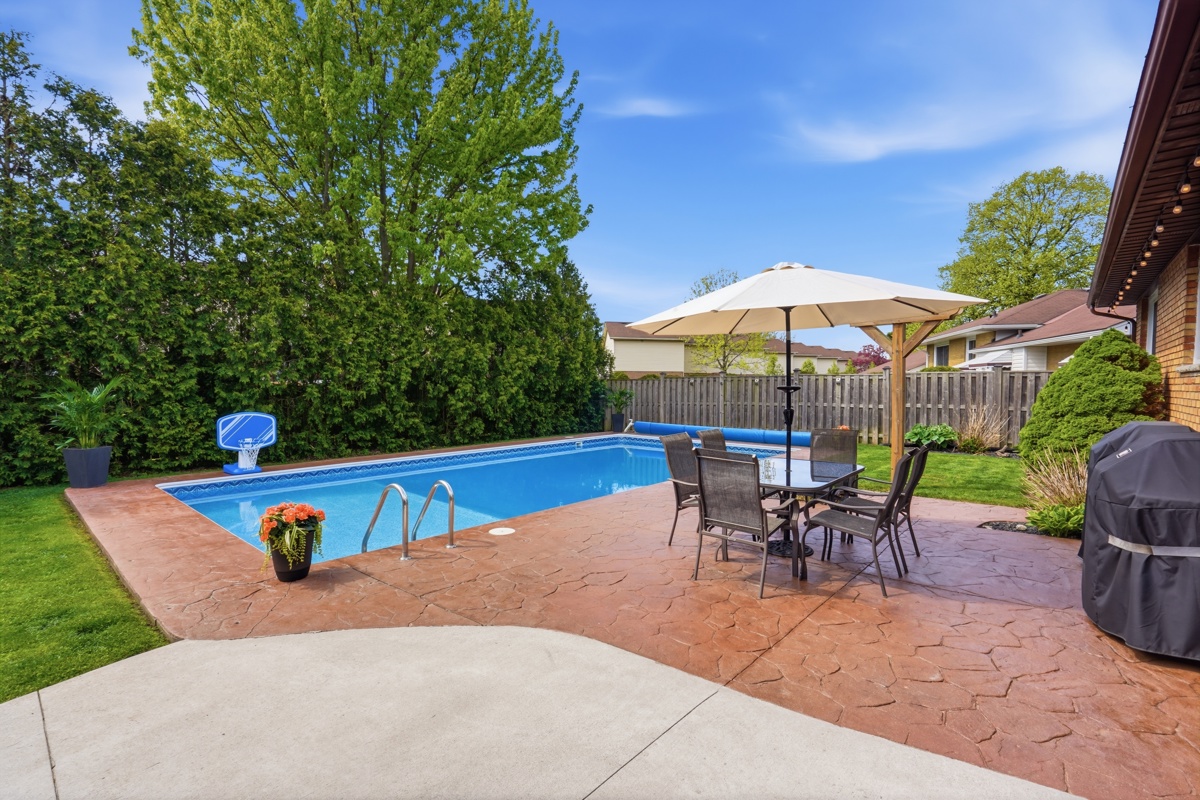 Backyard pool area evening — East London